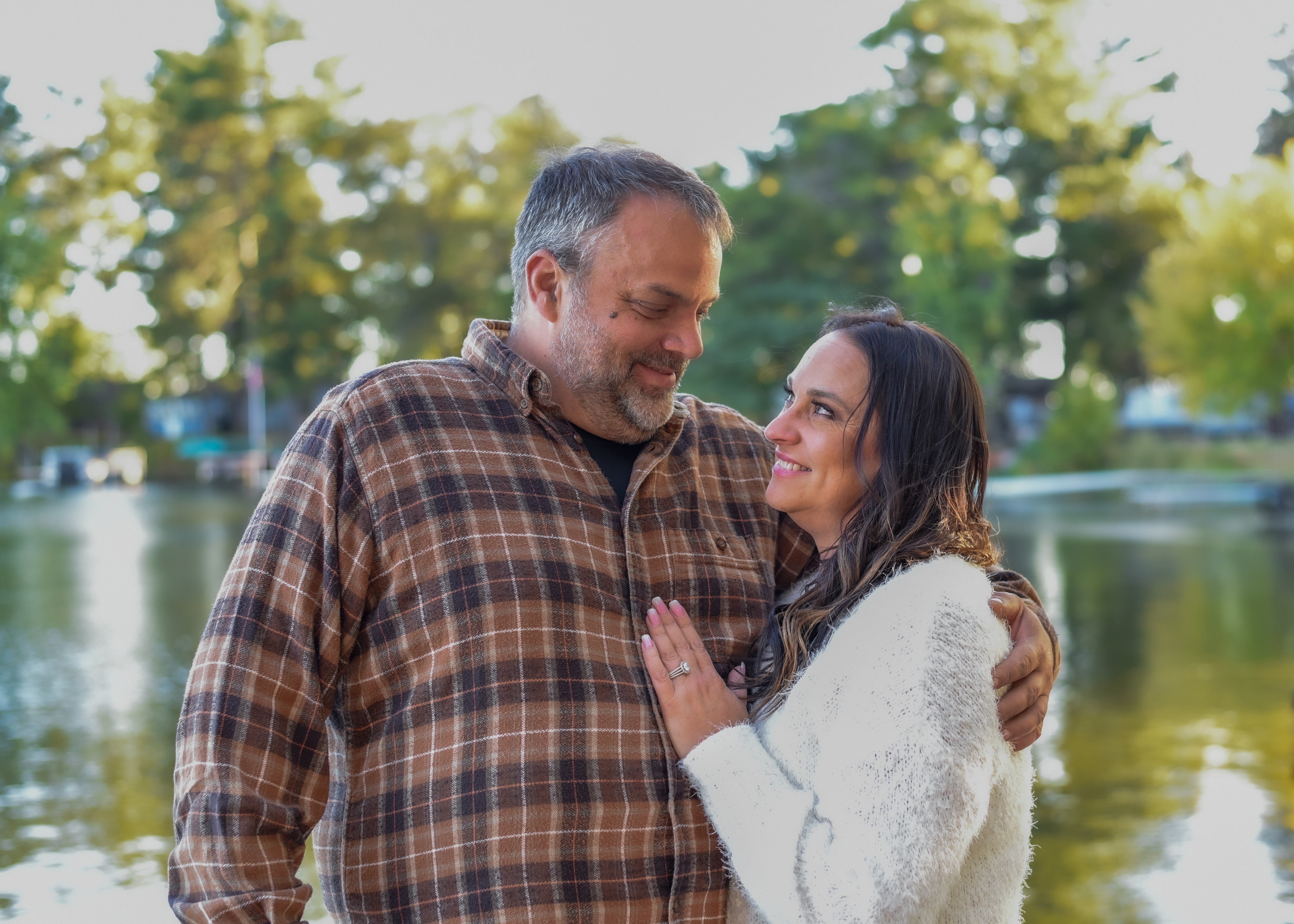 Candid family moment with children photographed in soft golden hour tones