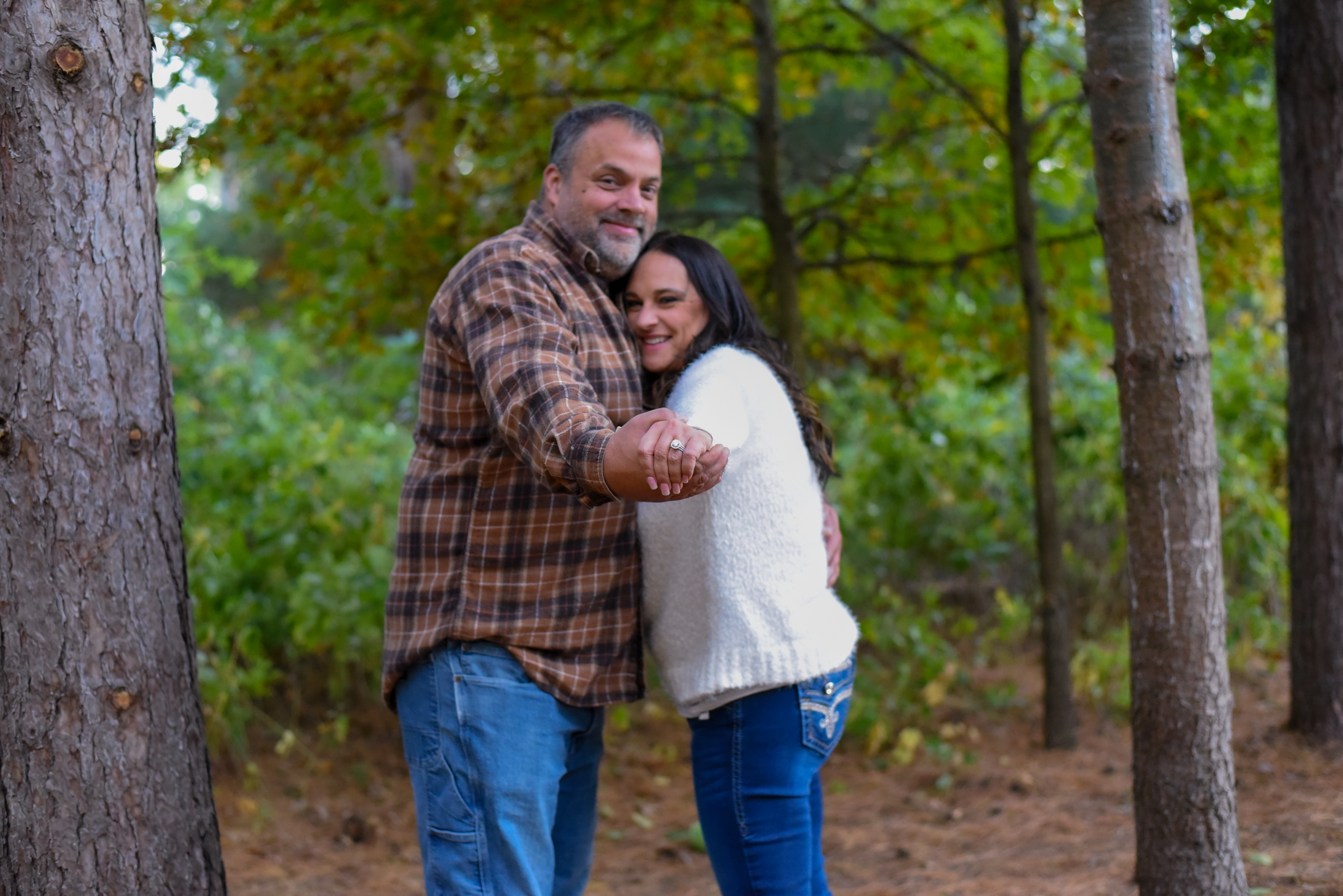 Pet-inclusive family portrait taken in Ellsworth Wisconsin at sunset