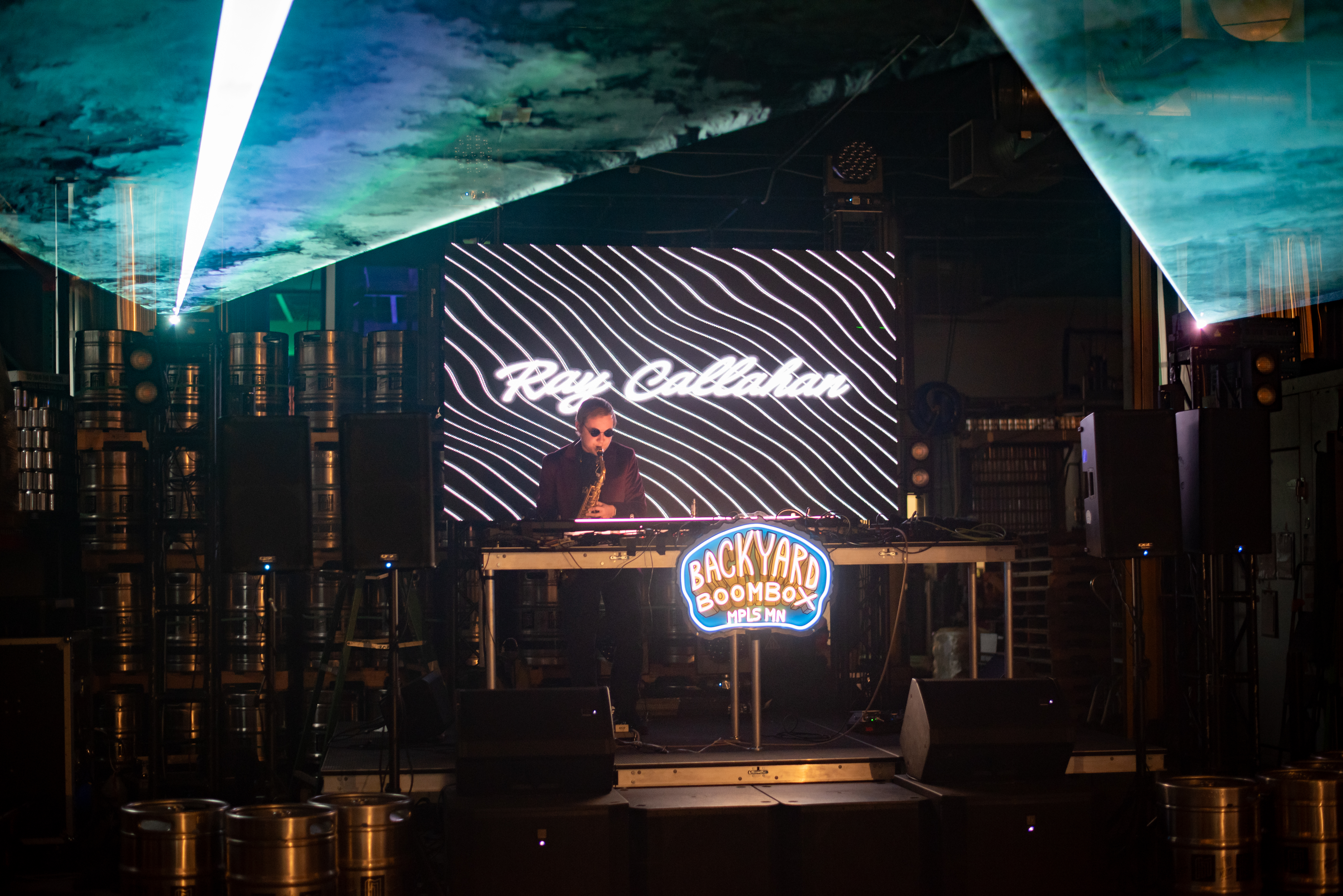 Stage performance portrait with dramatic lighting captured by Wisconsin photographer