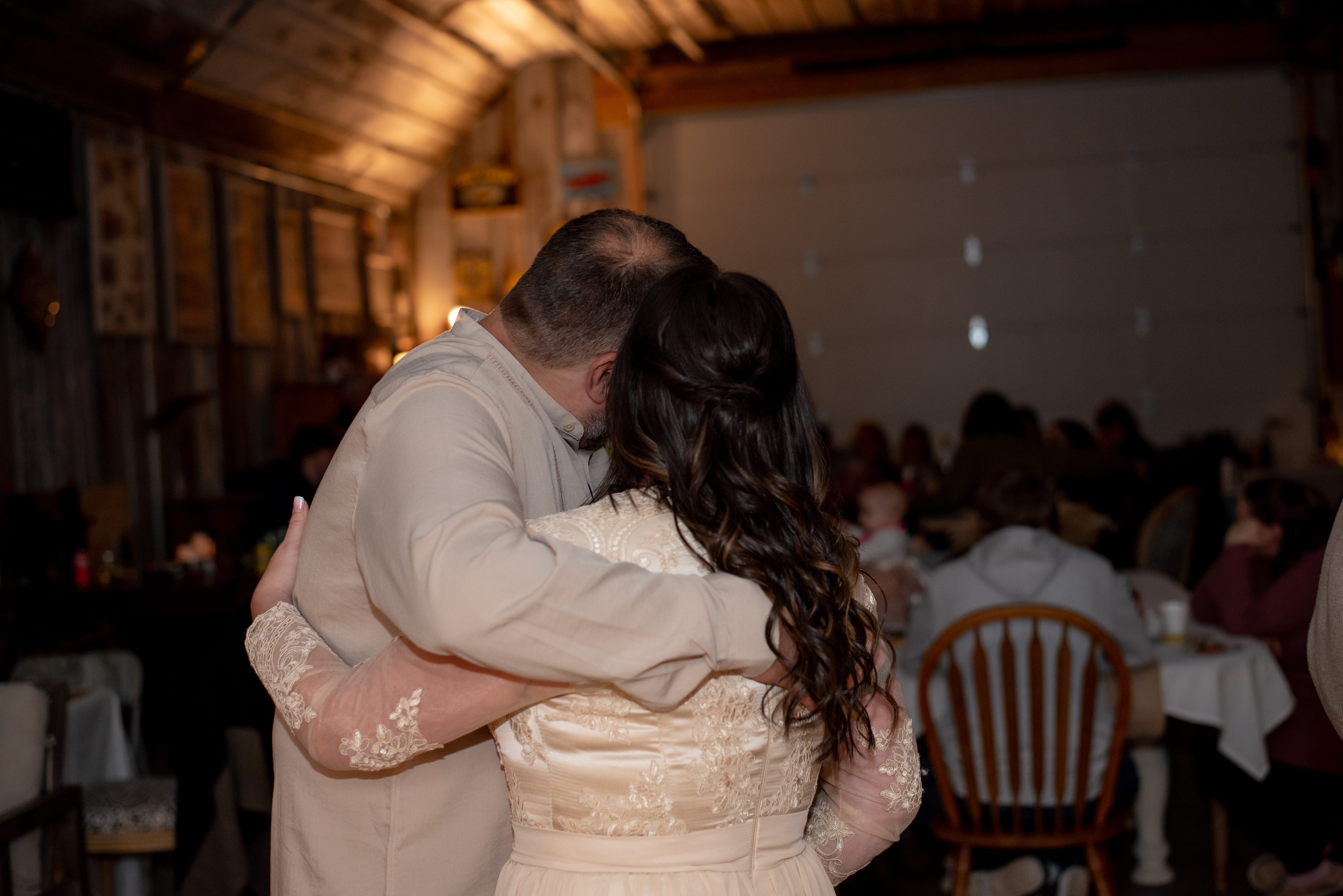 Emotional ceremony moment captured during outdoor Wisconsin wedding